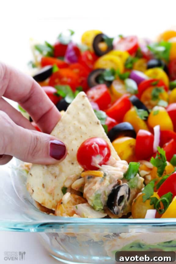The stunning, colorful presentation of a freshly made 7 Layer Dip, ready for dipping.