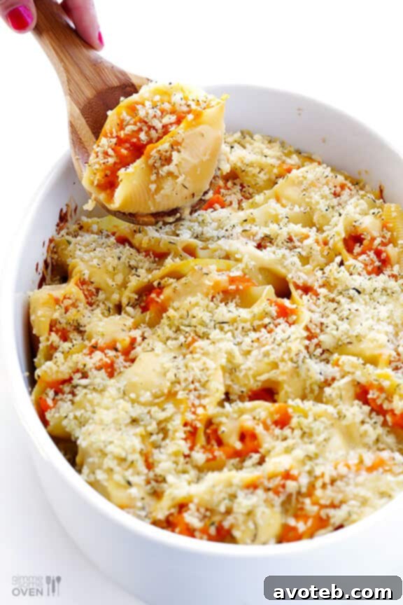 Velvety Butternut Alfredo Stuffed Shells 7 Jumbo pasta shells being stuffed with creamy butternut squash alfredo filling.