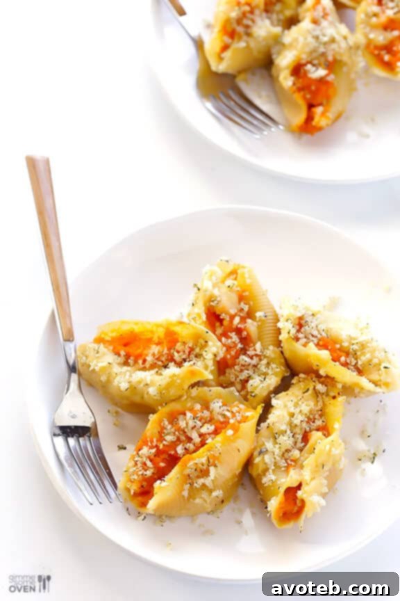 Velvety Butternut Alfredo Stuffed Shells 8 A serving of Butternut Squash Alfredo Stuffed Shells with a fork.