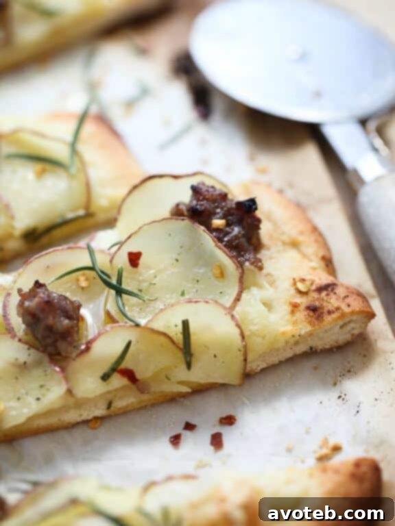 Red Potato, Sausage and Rosemary Fontina Pizza | foodiecrush.com - a rustic and comforting fall pizza with tender potatoes, savory sausage, and aromatic rosemary.