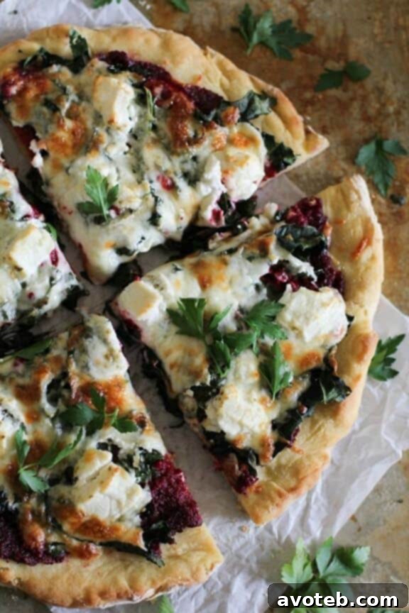 Beet Pesto Pizza with Kale and Goat Cheese | theroastedroot.net - a vibrant and healthy fall pizza featuring earthy beet pesto, kale, and creamy goat cheese.
