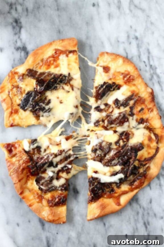 Short Rib Pizza with Caramelized Onions and a Smoked Gouda Cream Sauce | perpetuallyhungryblog.wordpress.com - a rich and savory fall pizza featuring tender short rib and smoky cheese.