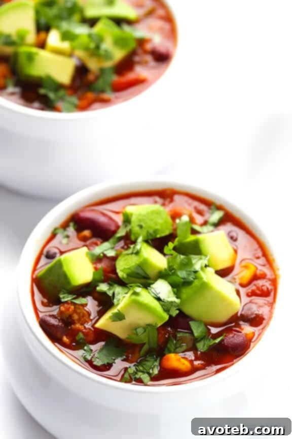 Slow Cooker Turkey Taco Chili with a variety of fresh toppings.