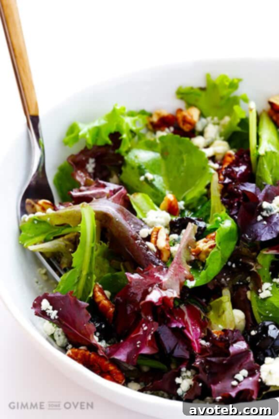 Drizzling White Balsamic Vinaigrette on salad