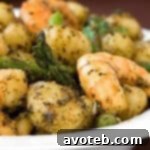 Gnocchi with Shrimp, Asparagus & Pesto, prepared and ready to serve.