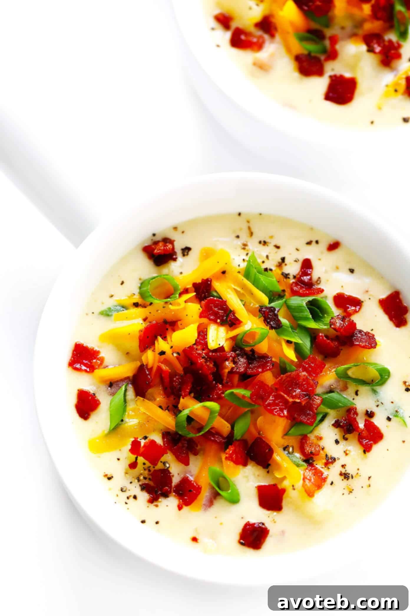 The BEST Potato Soup recipe! It's quick and easy to make, nice and creamy (with zero heavy cream), with lots of bacon (if you'd like). Total comfort food! | Gimme Some Oven #soup #potatosoup #dinner #bacon Loaded Homemade Potato Soup Recipe with all the toppings