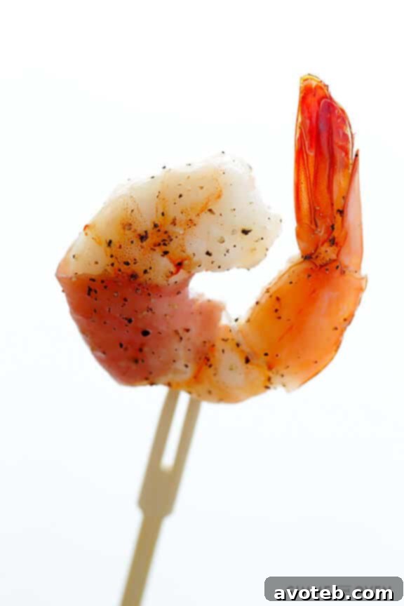 Effortless Prosciutto-Wrapped Prawns 3 Close-up of perfectly baked prosciutto-wrapped shrimp with golden edges
