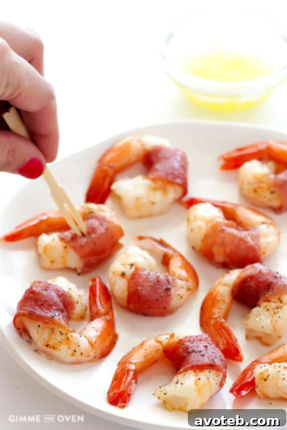 Effortless Prosciutto-Wrapped Prawns 8 Prosciutto-wrapped shrimp served with optional garlic butter dipping sauce