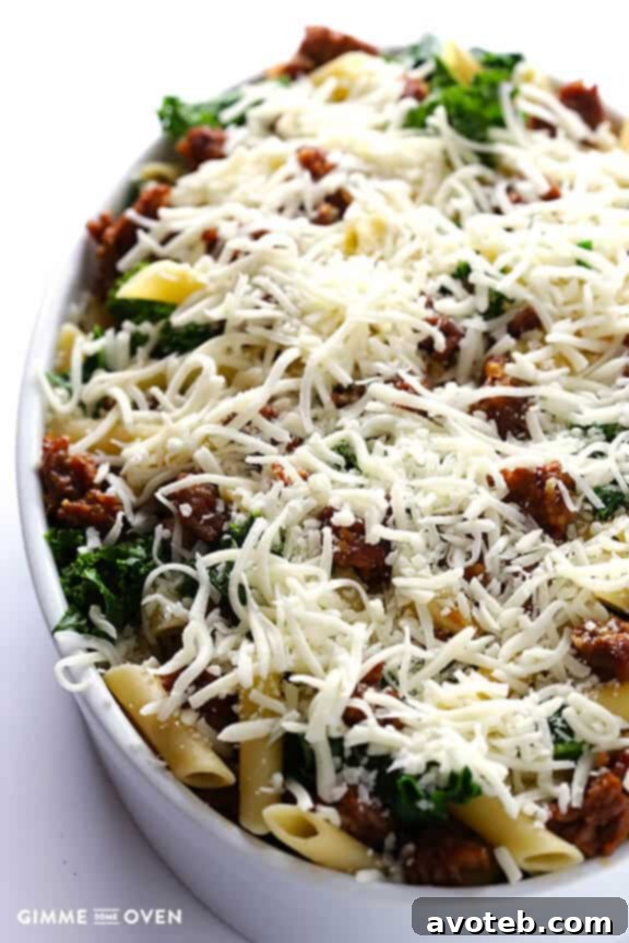 Browned Italian sausage, garlic, cooked ziti pasta, and fresh kale tossed together in a large pot.