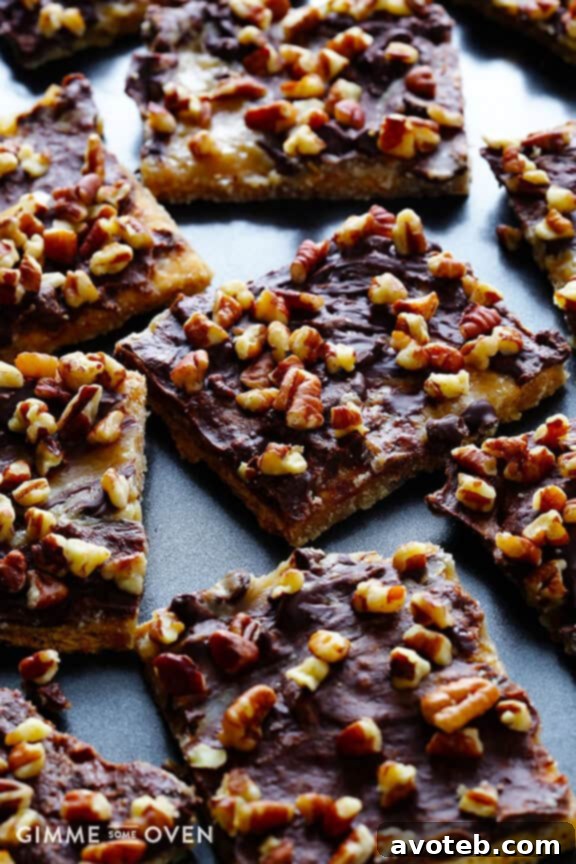 Close-up of Graham Cracker Toffee bars, showcasing the chocolate and pecan topping