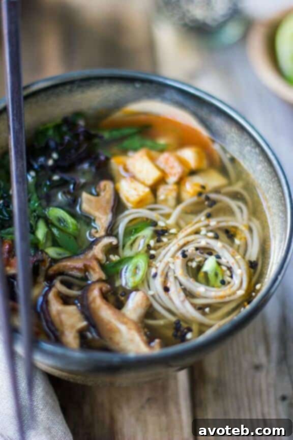 Flavorful Miso and Soba Noodle Soup with Roasted Sriracha Tofu and Shiitake Mushrooms for a vegetarian delight