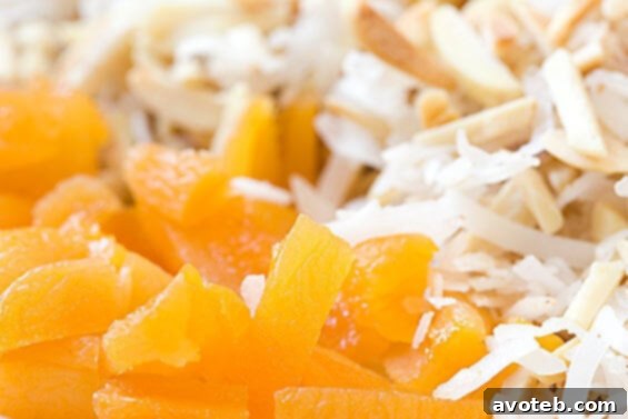 Close-up of creamy Israeli Couscous breakfast bowl with fruit and nuts