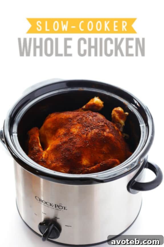 Close-up of a fully cooked slow cooker 'rotisserie' chicken, incredibly tender and ready to be served.