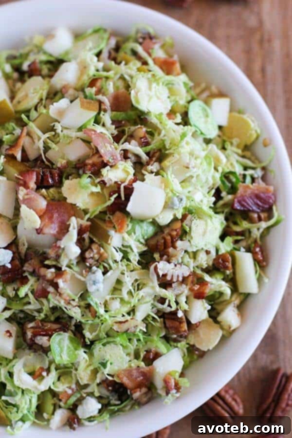Brussel Sprout Chopped Salad with Warm Bacon Vinaigrette | theroastedroot.net
