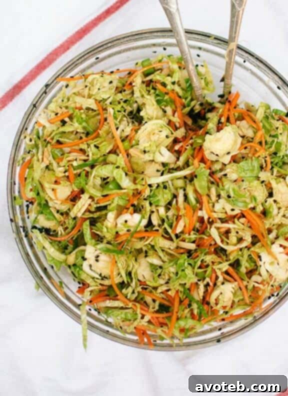 Asian Brussels Sprout Slaw with Carrots and Almonds | cookieandkate.com