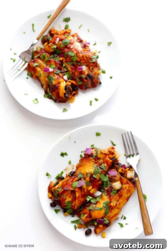 Close-up of BBQ Chicken Enchiladas, showing the tender chicken and sauce-soaked tortillas.