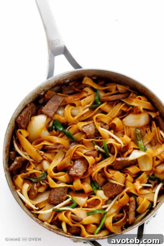 Beef Chow Fun Stir Fry 6 Cooked Beef Chow Fun being tossed in a wok