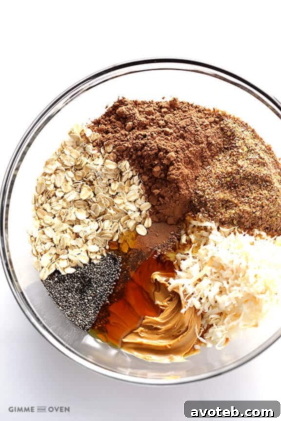 Mixing all ingredients for Chocolate Peanut Butter No-Bake Energy Bites in a bowl until evenly combined. | gimmesomeoven.com