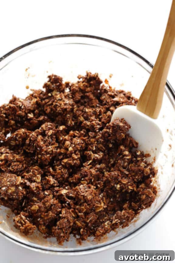 Chilling the chocolate peanut butter energy bite mixture in the refrigerator for at least 30 minutes to make it easier to handle and roll. | gimmesomeoven.com