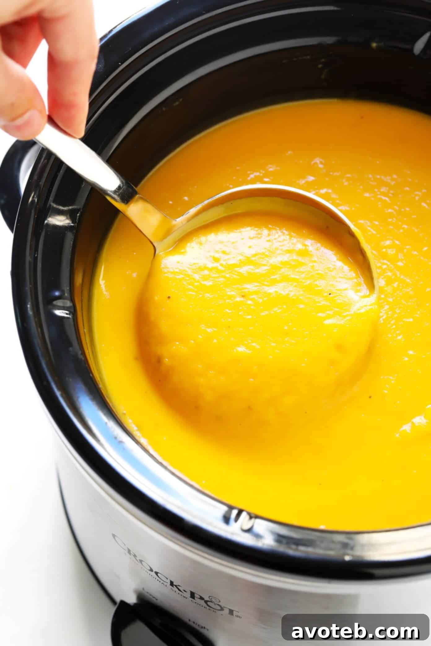 Creamy Butternut Squash Soup simmering in a slow cooker.