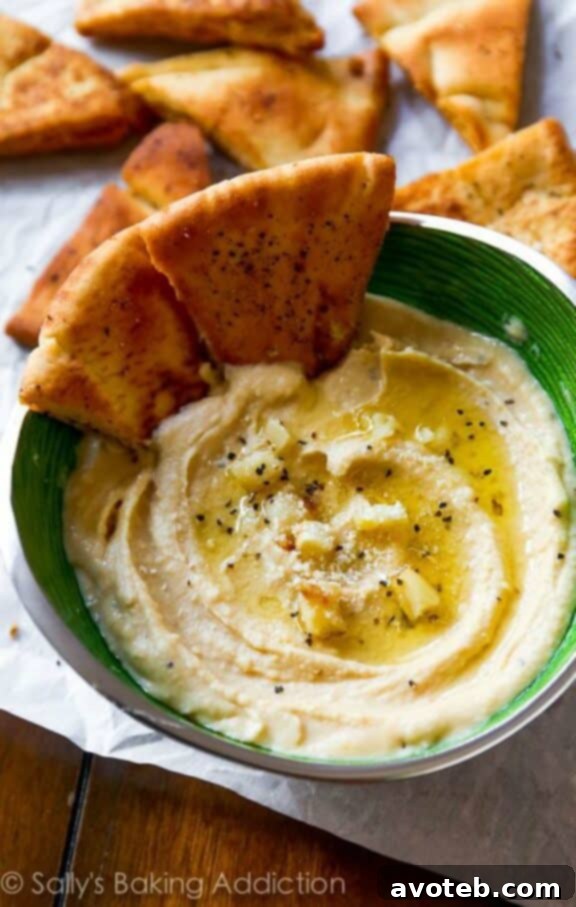 15 Recipes for Creamy Dreamy Hummus Bliss 13 An incredibly smooth and decadent Roasted Garlic Parmesan Hummus, topped with finely grated Parmesan cheese and a sprinkle of fresh chives or parsley. This rich dip promises an ultra-creamy, savory experience.