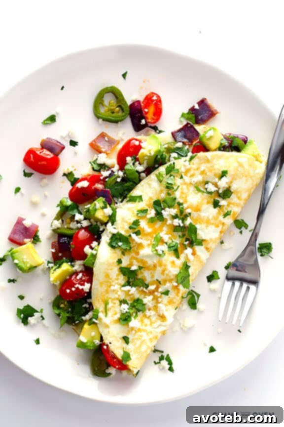 Delicious and healthy Mexican Egg White Omelet, a perfect quick breakfast, featuring vibrant colors and fresh ingredients.