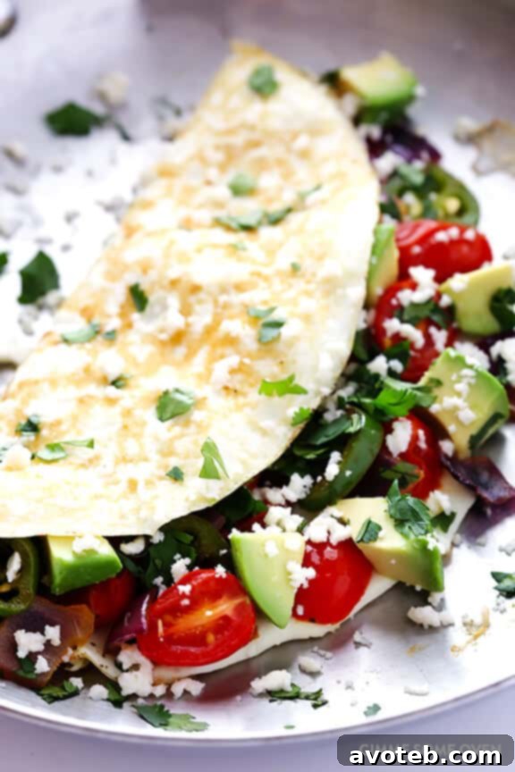 Step-by-step preparation of a Mexican Egg White Omelet, showcasing the ease of cooking and fresh ingredients.