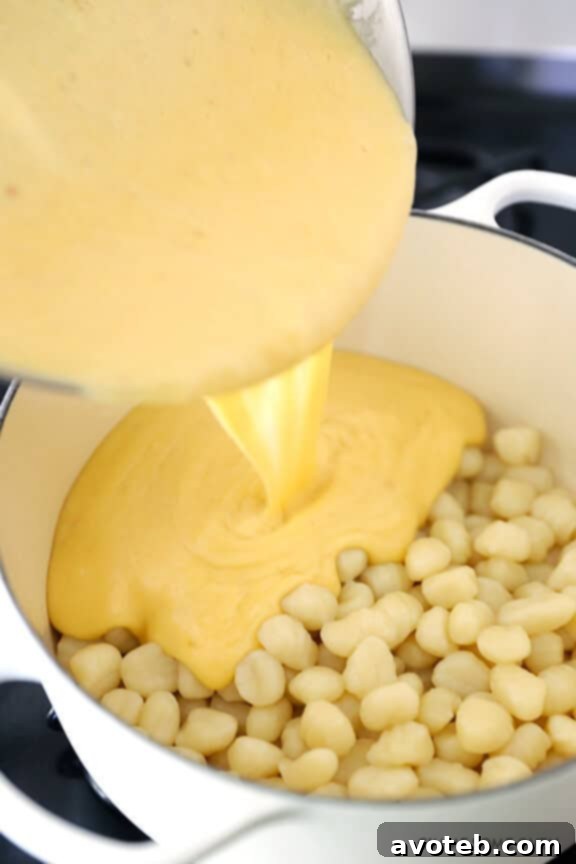 Gnocchi Cheese Gratin 7 Making the creamy cheese sauce for Gnocchi Mac and Cheese with three types of cheese