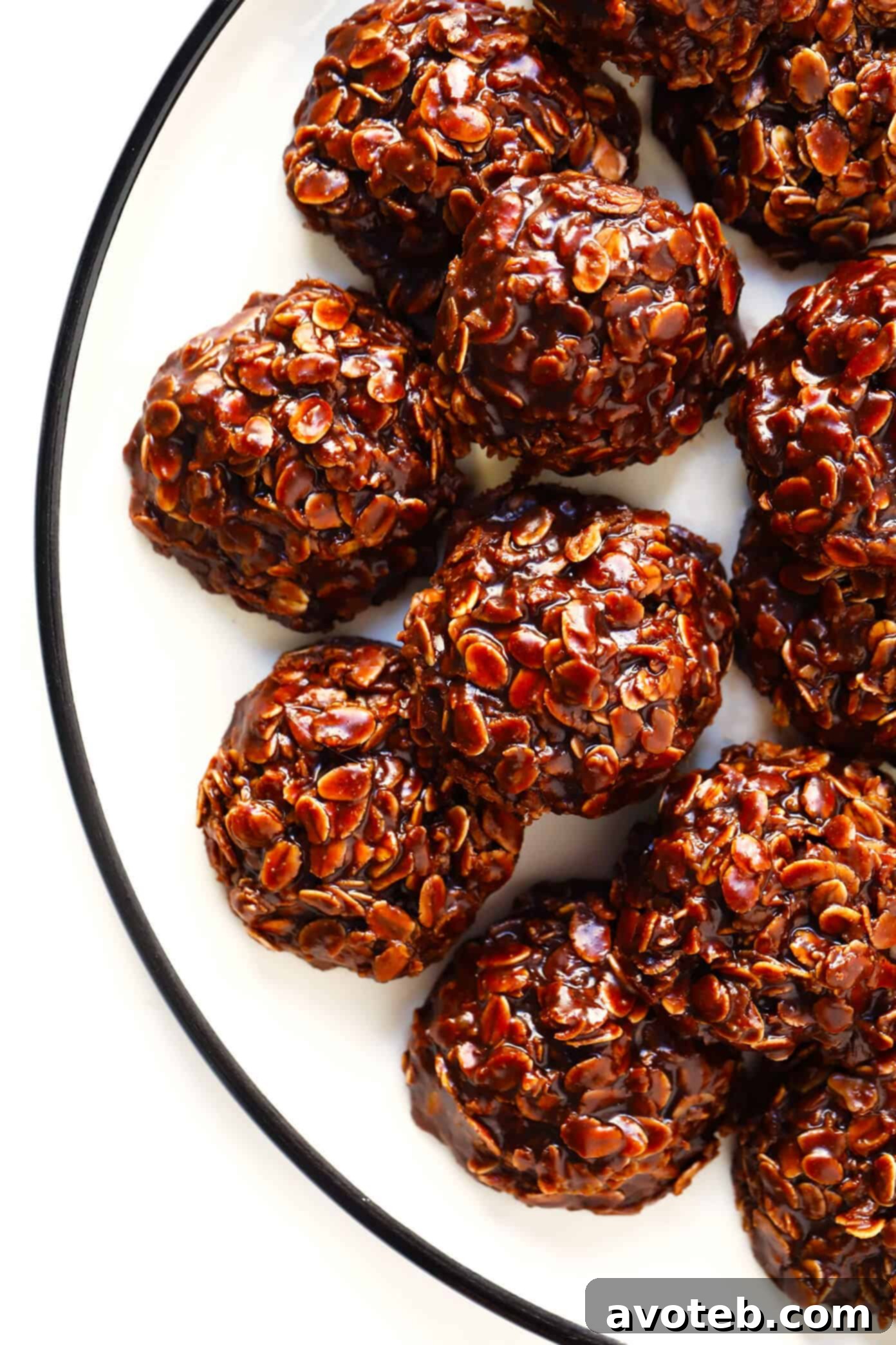 This classic No Bake Cookies recipe is easy to make in just 15 minutes, and that peanut butter + chocolate + oatmeal combination is always a winner! | Enjoy the perfect pairing of peanut butter and chocolate in these delightful no-bake cookies. #chocolate #nobake #cookies #peanutbutter #oatmeal #dessert Peanut Butter and Chocolate No Bake Cookies