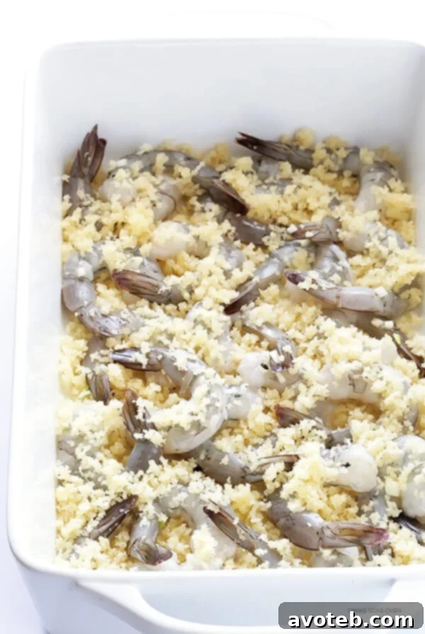 Melted butter being mixed with Panko breadcrumbs in a bowl.
