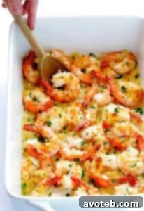 A close-up of a serving of Garlicky Baked Shrimp, showing the golden Panko topping and tender shrimp.