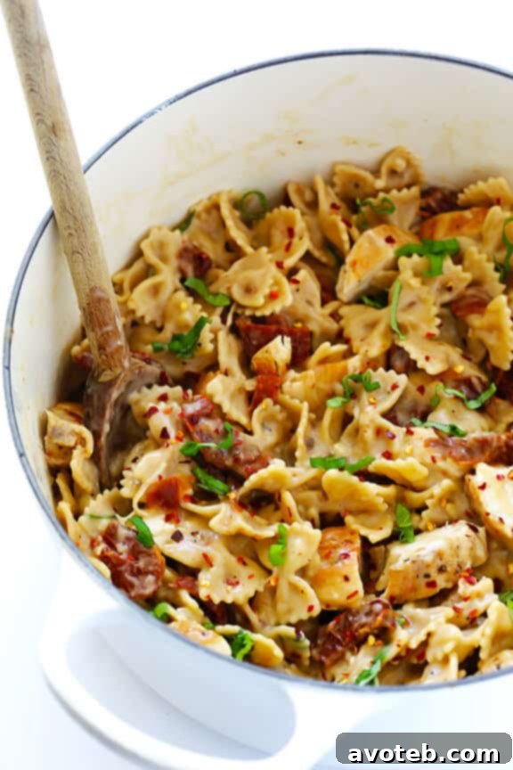 Creamy Pasta with Chicken & Sun-Dried Tomatoes -- a wholesome and quick meal ready in 30 minutes, featuring a lightened-up, rich sauce. Discover this delightful recipe at avoteb.com