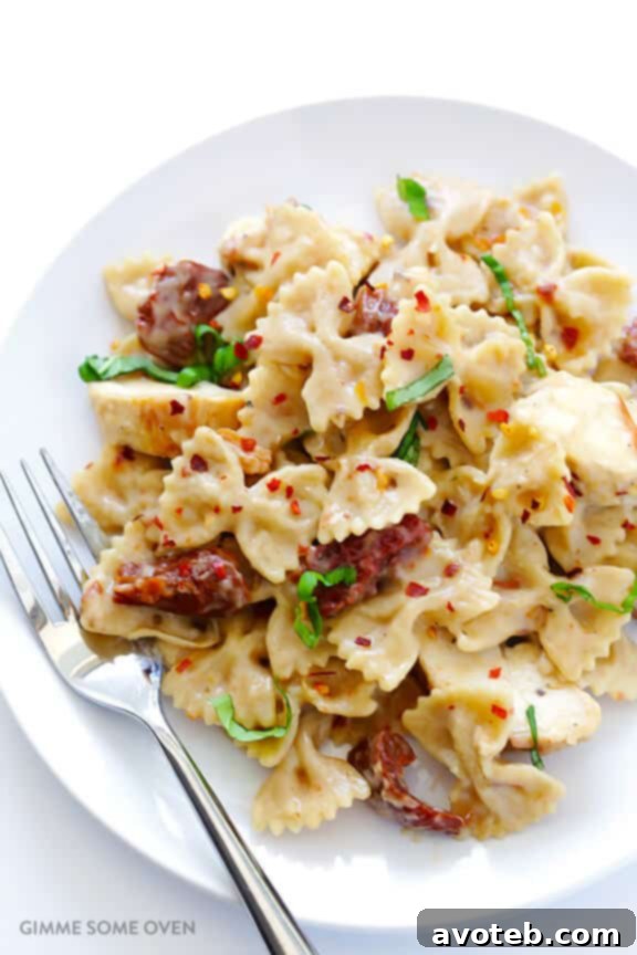 Creamy Pasta with Chicken & Sun-Dried Tomatoes -- a wholesome and quick meal ready in 30 minutes, featuring a lightened-up, rich sauce. Discover this delightful recipe at avoteb.com