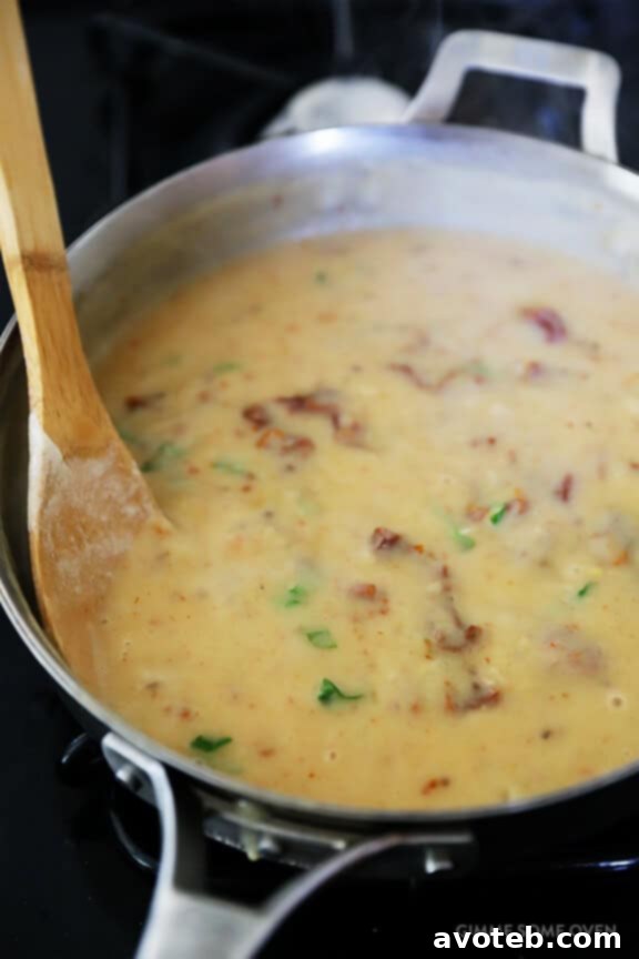 Creamy Pasta with Chicken & Sun-Dried Tomatoes -- a wholesome and quick meal ready in 30 minutes, featuring a lightened-up, rich sauce. Discover this delightful recipe at avoteb.com