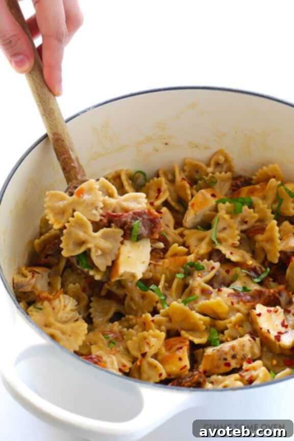Creamy Pasta with Chicken & Sun-Dried Tomatoes -- a wholesome and quick meal ready in 30 minutes, featuring a lightened-up, rich sauce. Discover this delightful recipe at avoteb.com