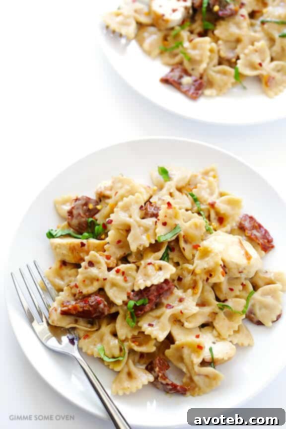 Creamy Pasta with Chicken & Sun-Dried Tomatoes -- a wholesome and quick meal ready in 30 minutes, featuring a lightened-up, rich sauce. Discover this delightful recipe at avoteb.com