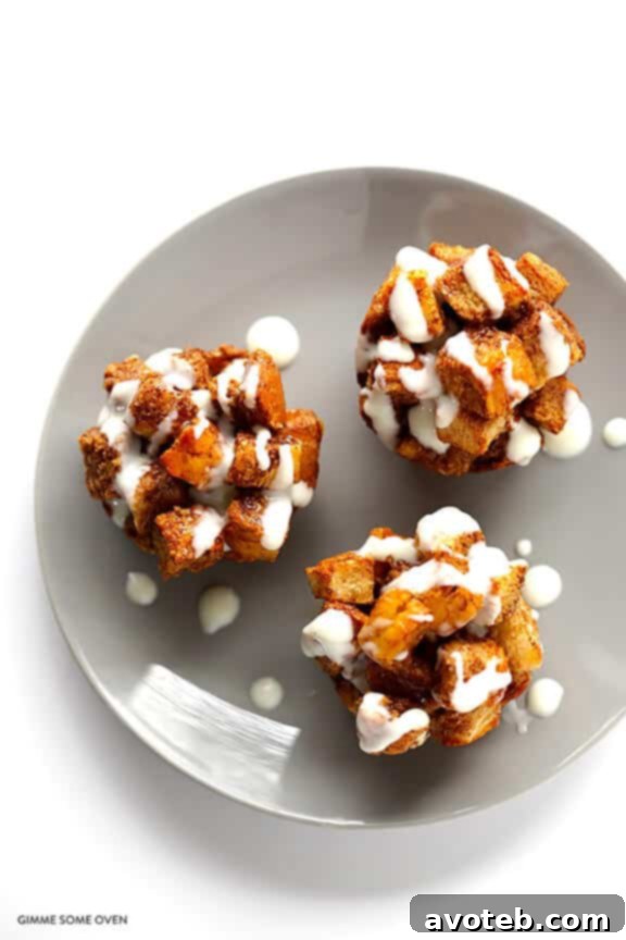 Homemade French Toast Cups with a decadent whiskey glaze featured prominently on a vibrant brunch table