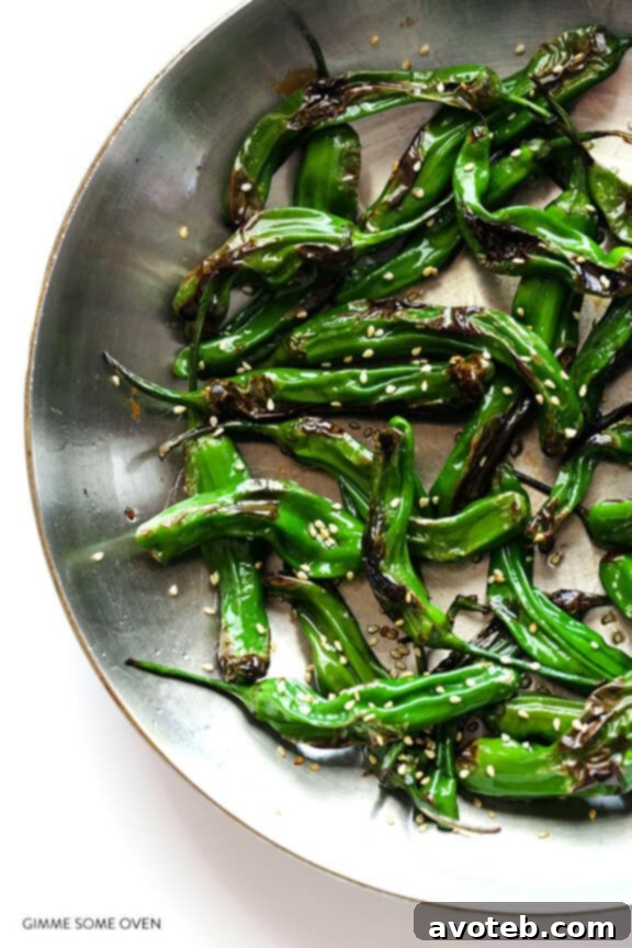 Toasted Sesame Shishito Bites 6 Blistered Shishito Peppers tossed with sesame seeds in a bowl