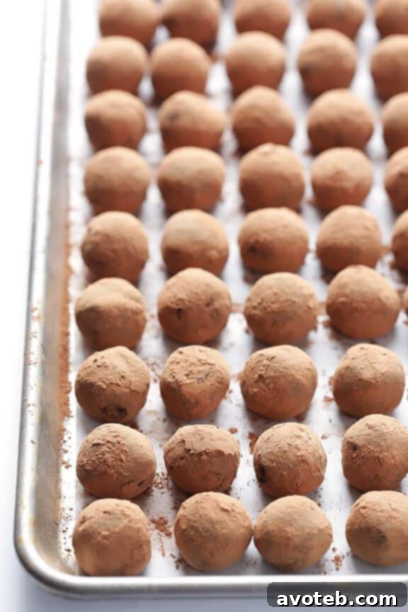 Rolling Whiskey Chocolate Truffles in Cocoa Powder