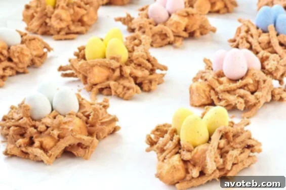 Close-up of a finished Butterscotch Birds' Nest cookie, showcasing the texture of chow mein noodles and marshmallows, ready for candy eggs.