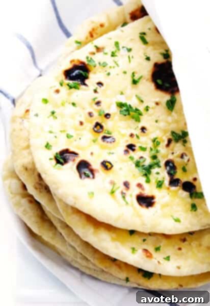 Soft Homemade Naan Wrapped in a Clean Towel