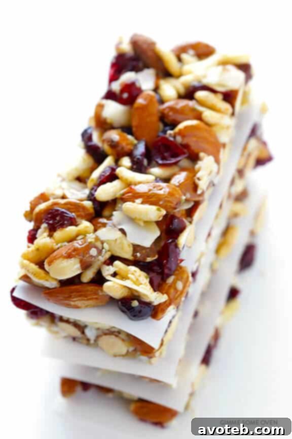 Perfectly sliced homemade Cranberry Almond Protein Bars arranged on a cutting board, ready for storage or immediate enjoyment.