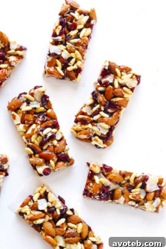 Multiple Cranberry Almond Protein Bars artfully stacked on a clean white plate, ready for a healthy and energizing snack.