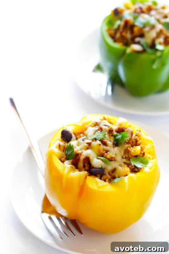 LOVE this 5-Ingredient Vegetarian Stuffed Peppers recipe! It's easy, cheesy, filled with lots of quinoa and black beans, and SO delicious! | gimmesomeoven.com 
