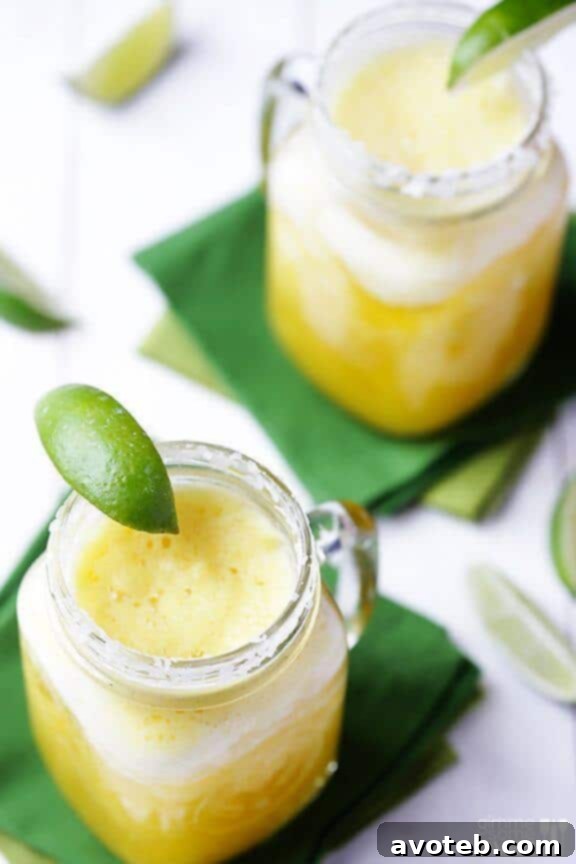 15 Must Try Margarita Creations 13 A vibrant fresh pineapple margarita, tropical and tangy, promising an exotic escape in a glass.