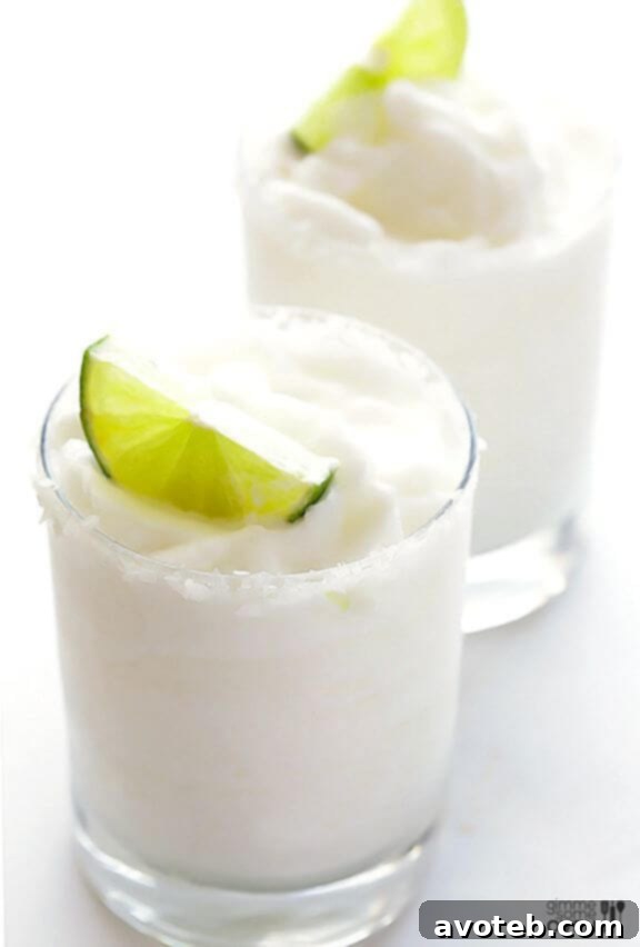 15 Must Try Margarita Creations 6 A creamy and enticing coconut margarita served in a frosted glass, promising a tropical island dream.