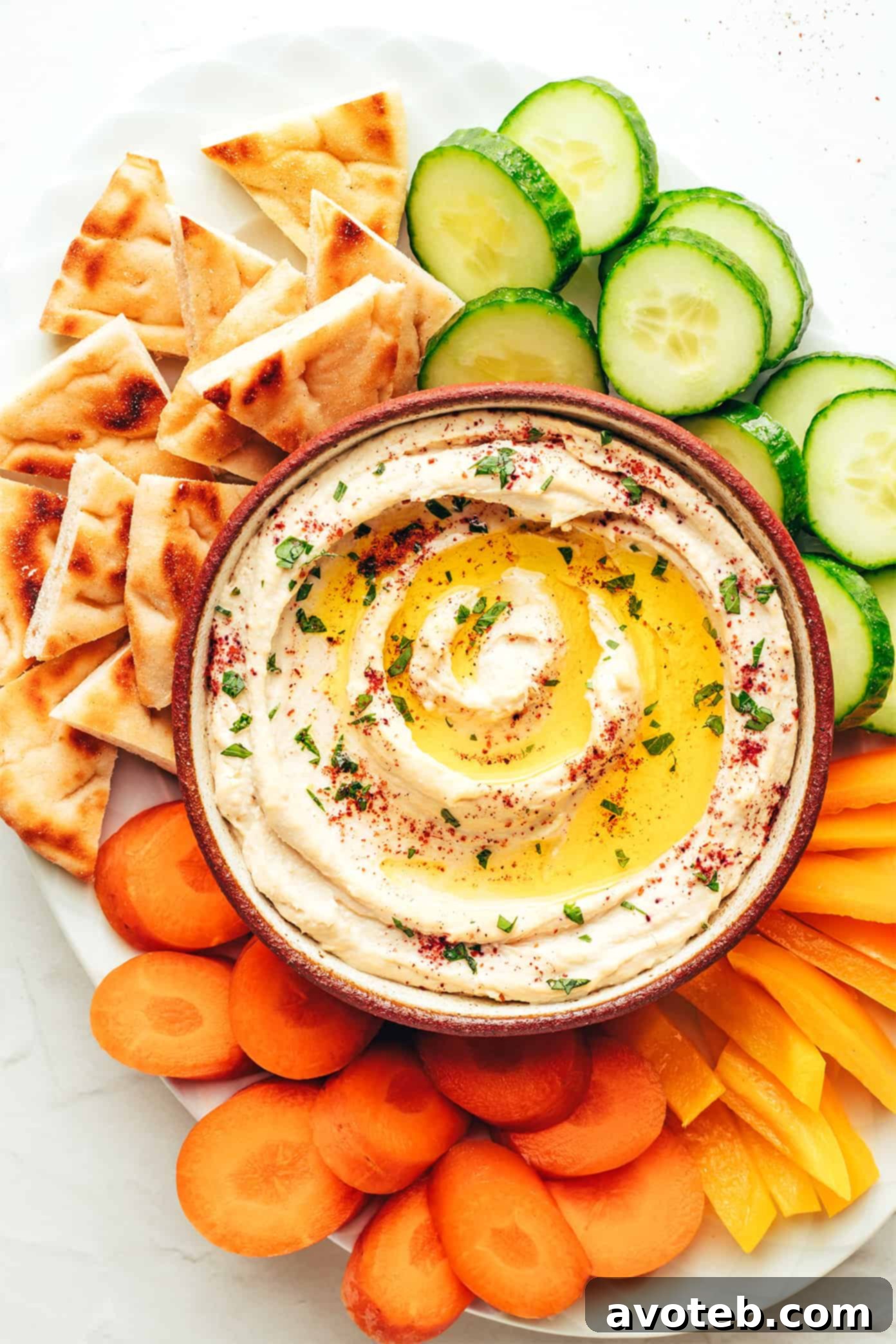 The Art of Hummus 7 A collection of small bowls filled with different ingredients and toppings, ready to be served with hummus.