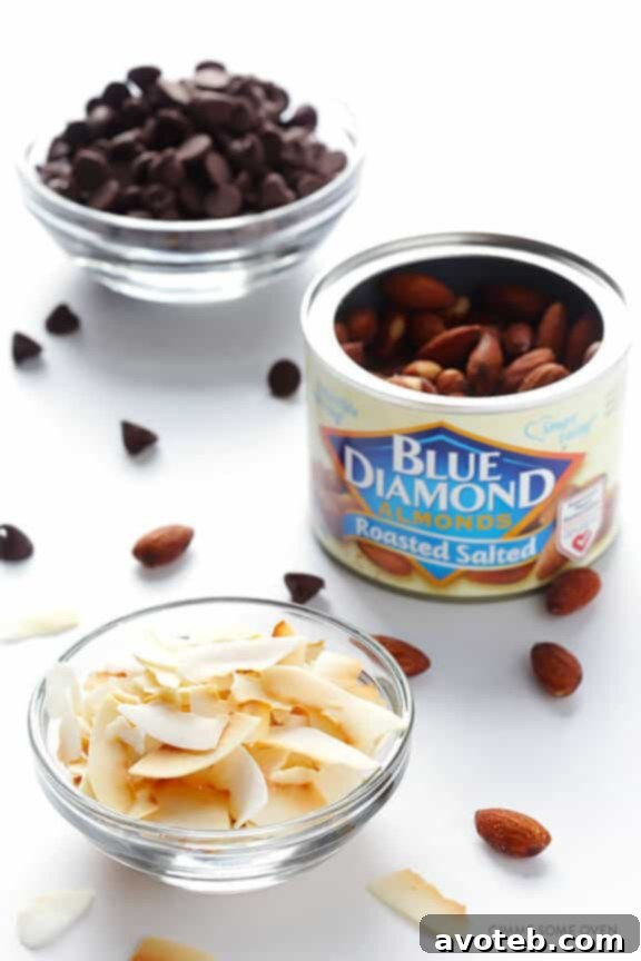 A luscious chocolate ganache being poured over the chilled Almond Joy Cheesecake.