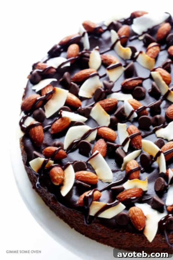 A close-up of the beautifully decorated Almond Joy Cheesecake, showcasing its enticing layers and toppings.