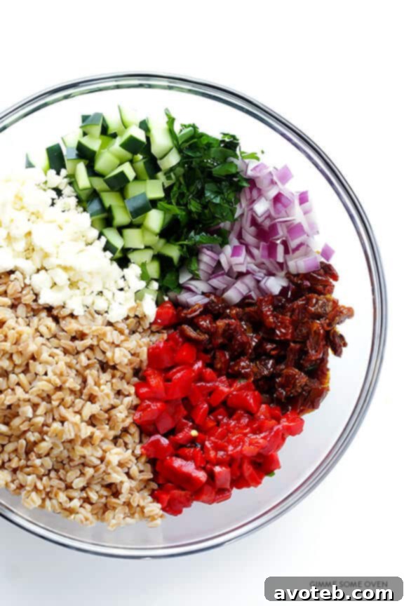 Close-up of vibrant Mediterranean Farro Salad with fresh herbs and feta cheese.